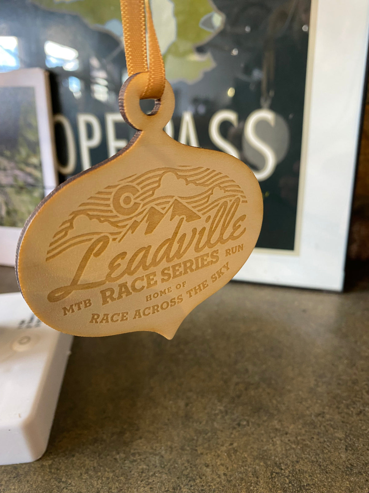 LRS Holiday Wood Ornament - Race Across Sky Bulb
